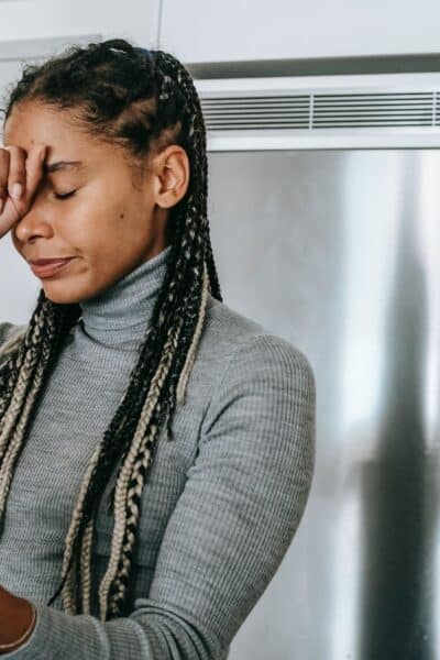 sad young ethnic lady arguing during video call